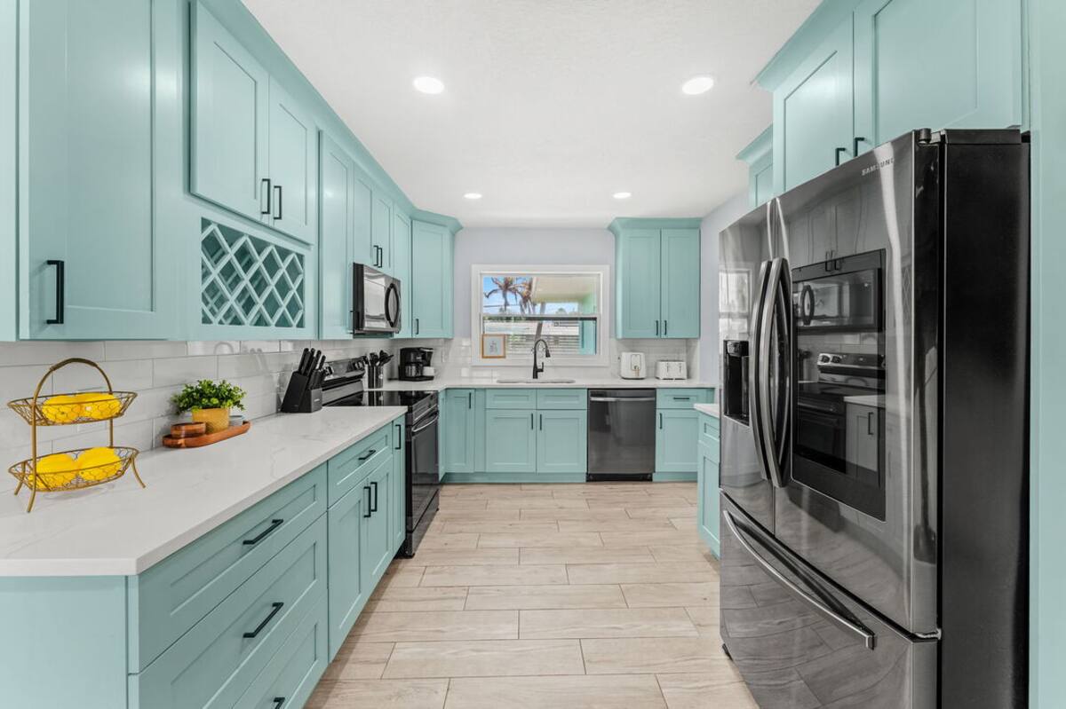 Kitchen with full-size refrigerator and ample counter space