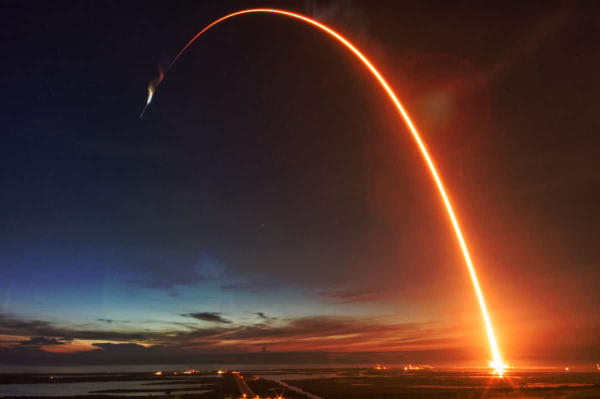 Rocket launch streaking over the Space Coast at dusk