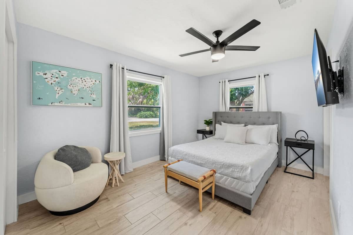 Third bedroom with queen bed and reading chair