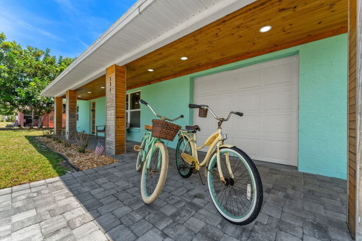 Beach cruiser bikes parked under the covered carport
