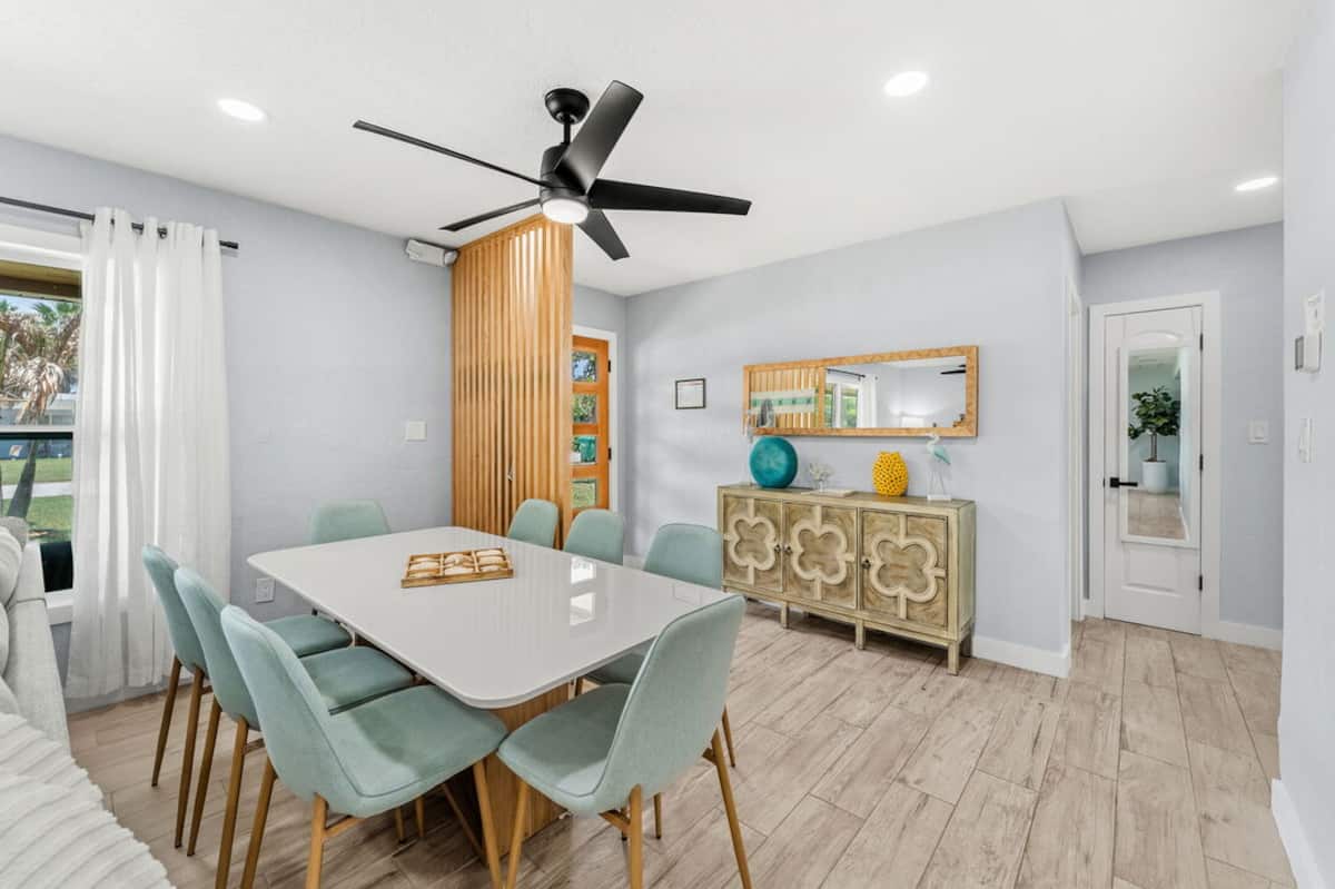 Dining table with seating for six beside the front windows